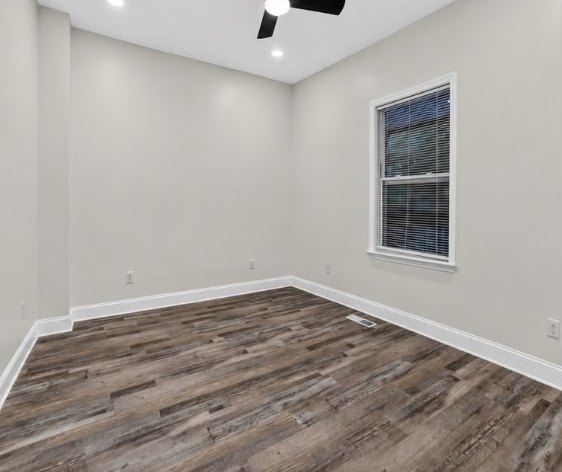 Renovated bedroom with ceiling fan and new flooring at 1713 S Orchard Knob Ave in Chattanooga