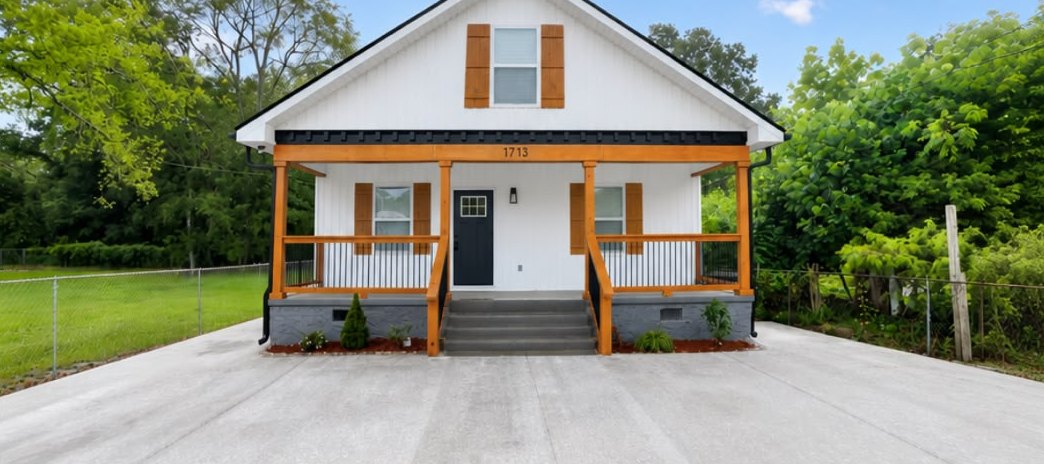 1713 S Orchard Knob Ave after — fully renovated white bungalow with cedar porch posts and new concrete drive in Chattanooga