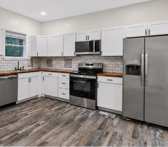 New kitchen with white shaker cabinets and subway tile at 1713 S Orchard Knob Ave in Chattanooga