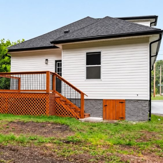 Side exterior with new siding and cedar rear deck at 1713 S Orchard Knob Ave in Chattanooga