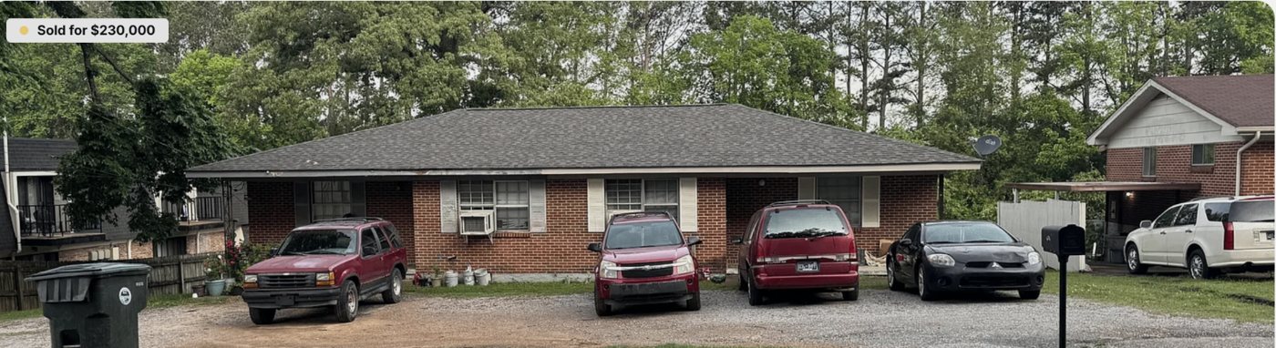 1723 N Concord Rd before — brick duplex focused on the building in Chattanooga