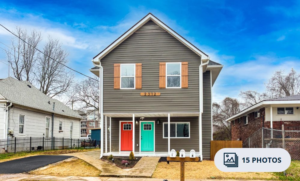 2312 E 14th St after — renovated 3-unit property exterior with new siding and porch in Chattanooga